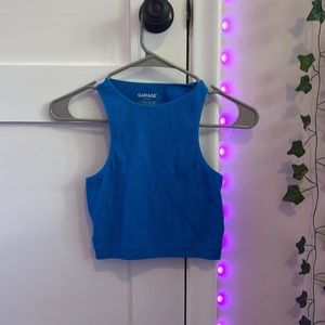 I am selling a tank top from garage. Size is XS. Color is a Royal blue